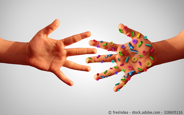Zwei Hände, eine ist voller Bakterien und Viren